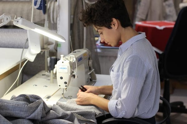 worker using sewing machine