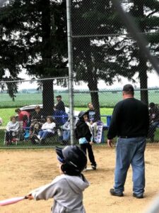 young girl playing tball