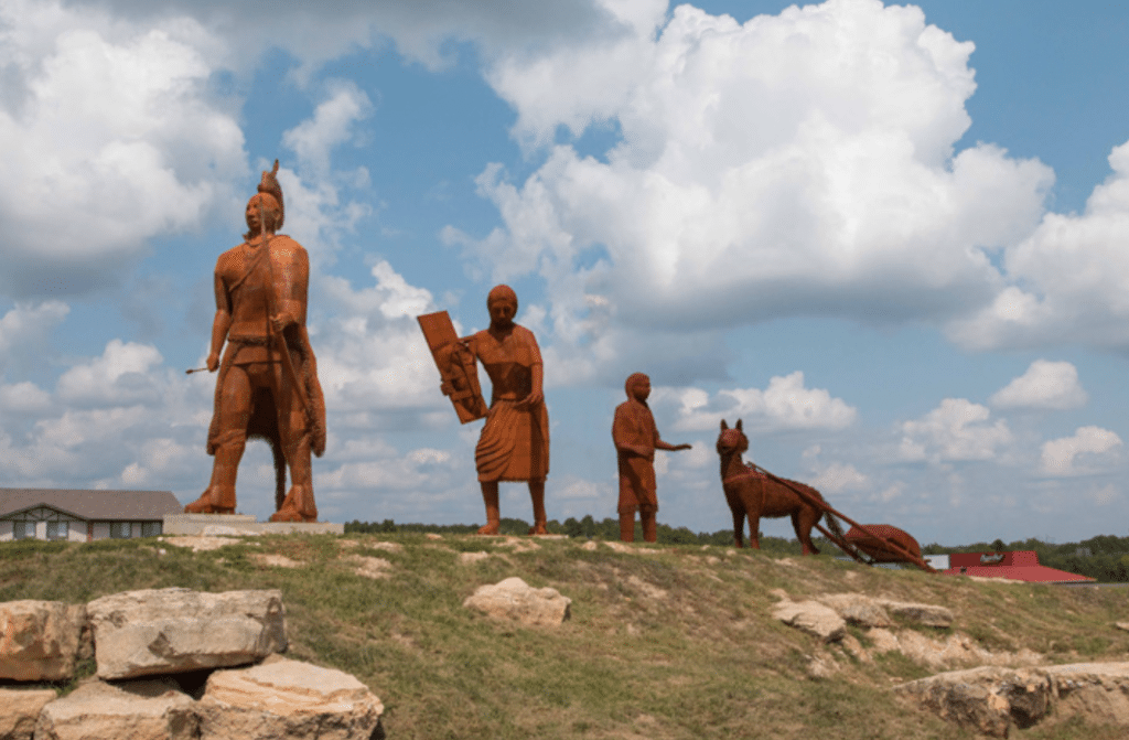A metal sculpture by artist Glen Tutterrow stands proudly at the Cuba Visitor Center and depicts an ancient Osage family on the move westward.