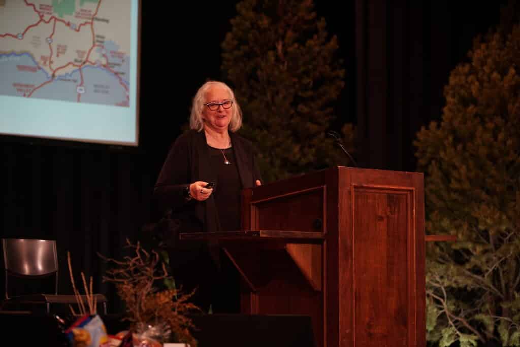 Deb smiling while presenting in San Juan County Utah