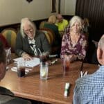 Deb and Amy at a table in Battle Mountain NV taking notes