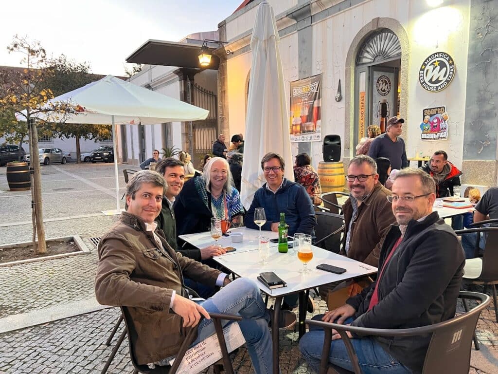 Evora Portugal Deb in Portugal eating outside with five leaders