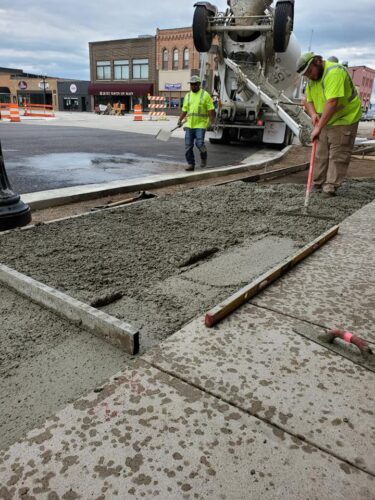 workers at work laying cement