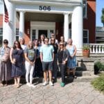 content creators in front of historic building