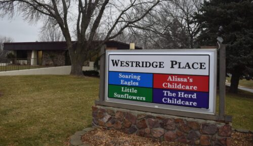sign in front of building for childcare