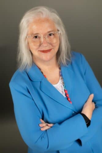 Deb's headshot dressed in blue