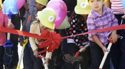 kids in hard hats with shovels