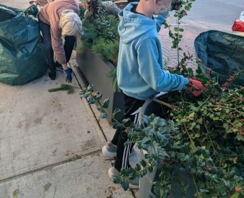 planter being decorated by store owners family for the holidays
