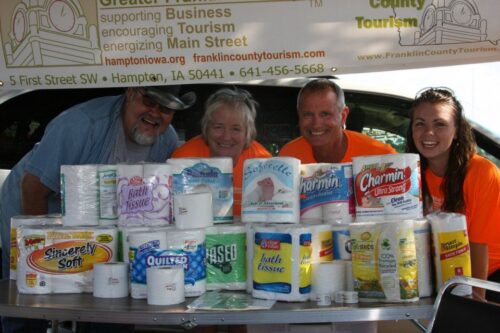 Photo taken at the County Fair and Chamber staff is in orange shirts. Photo from the Greater Franklin County Chamber Facebook page. (Brook is second from the right.)