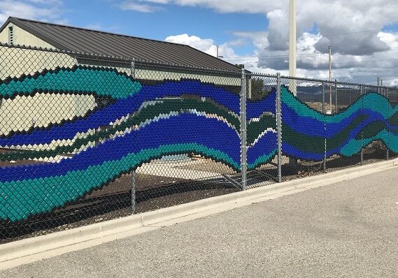 Boise Idaho art at the water plant on a chain link fence - looks like waves