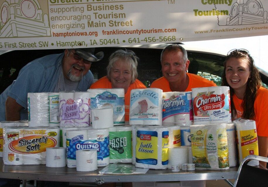 Photo taken at the County Fair and Chamber staff is in orange shirts. Photo from the Greater Franklin County Chamber Facebook page. (Brook is second from the right.)