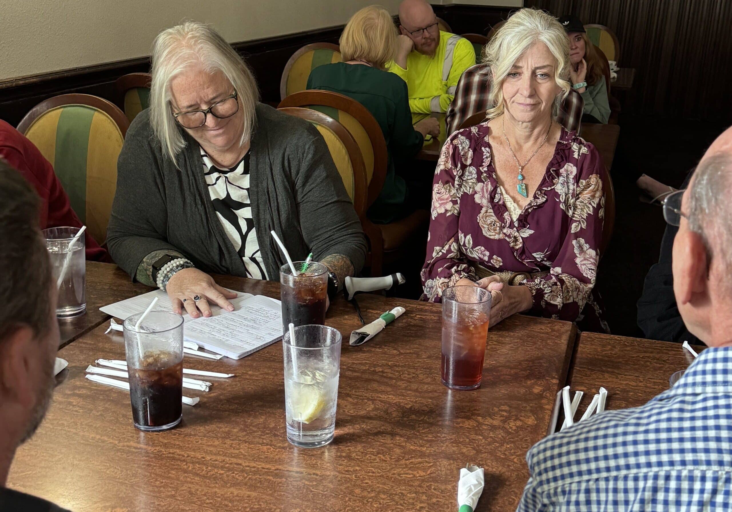 Deb and Amy at a table in Battle Mountain NV taking notes