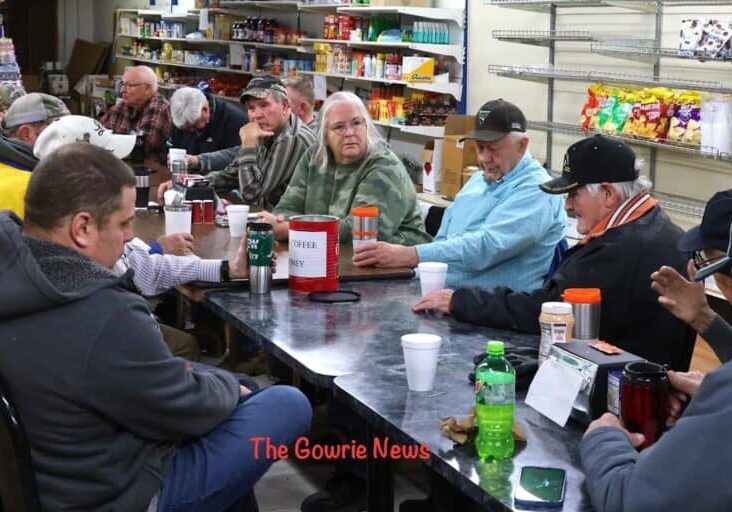 Locals meet at the Gowrie, Iowa grocery store for coffee