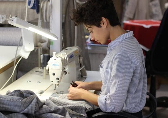 worker using sewing machine